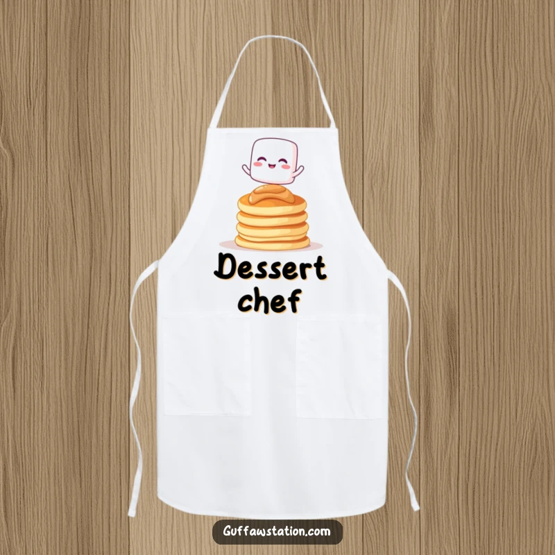 Funny apron with a giggling marshmallow character balancing on pancakes, great for kitchen use.