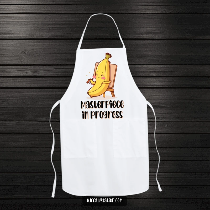Funny banana apron with a blushing banana painting its self-portrait using its peel, humorous and practical chef wear.