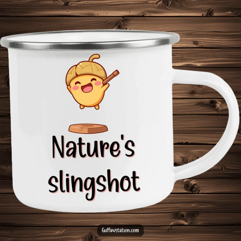Funny camping mug with a determined acorn launching from a slingshot, perfect for outdoor beverages and energetic mornings.