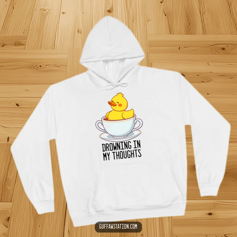 Funny confused rubber duck bobbing in a giant teacup, designed for cozy and humorous casual wear.