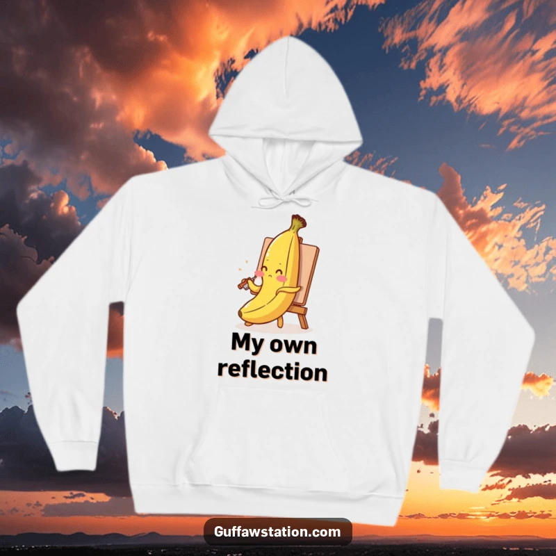 Funny banana hoodie with a blushing banana painting its self-portrait with its peel, a warm and humorous design.
