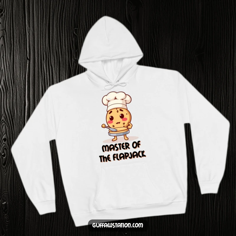 Funny cookie chef wearing a hat, flipping pancakes, a cozy and humorous hoodie for food lovers.