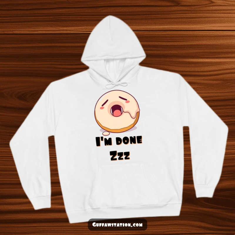 Funny sleepy donut character yawning, with frosting dripping, depicted on a super soft and cozy hoodie.