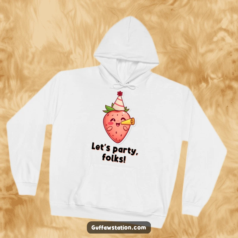 Funny cheerful strawberry wearing a party hat and blowing a horn, depicted on a warm and festive hoodie.