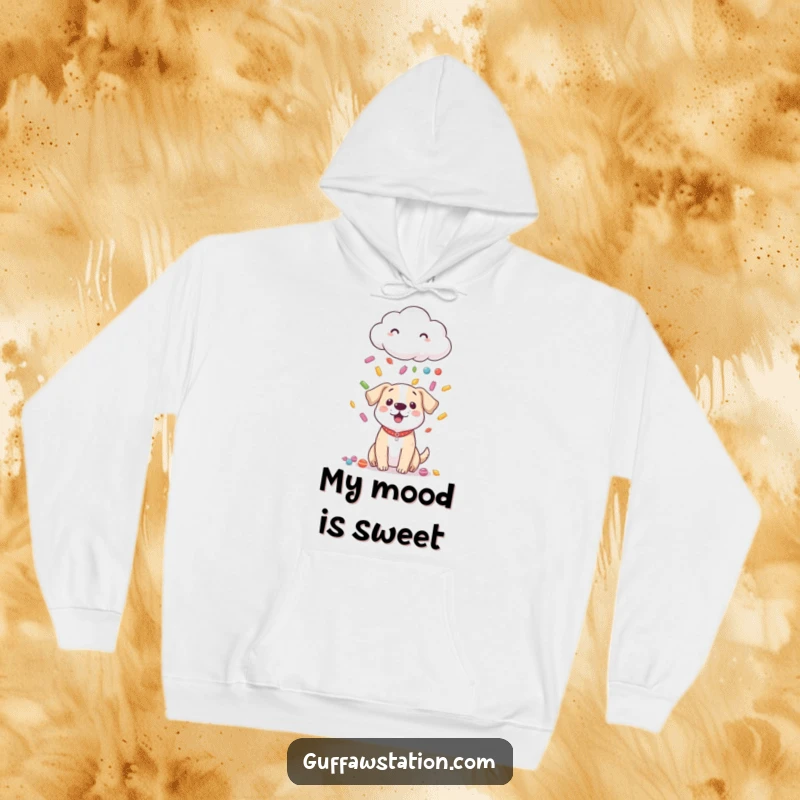 Funny hoodie featuring a shy cloud raining colorful candy down on a surprised, receptive dog, radiating warmth and joy.